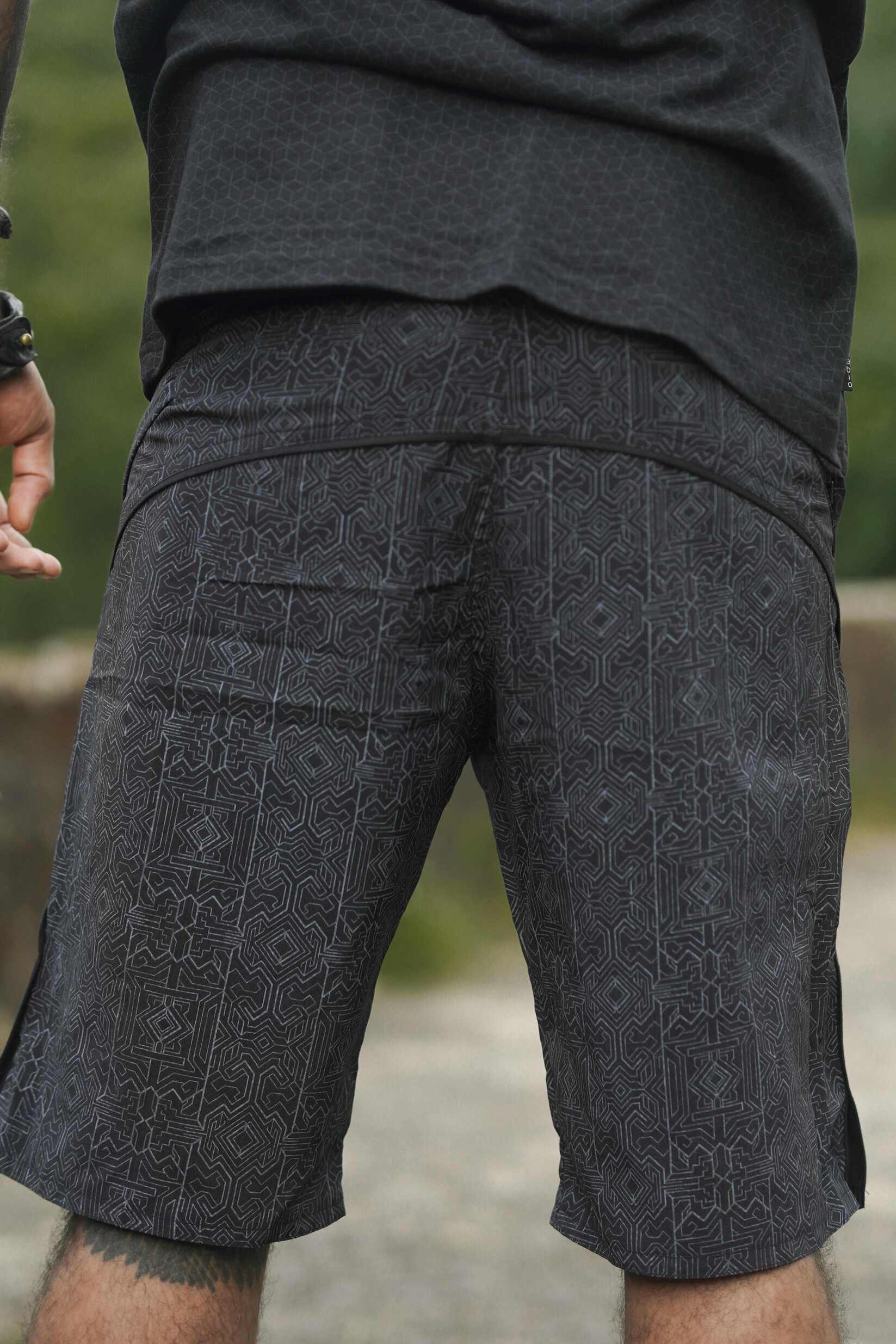 black patterned board shorts men back view